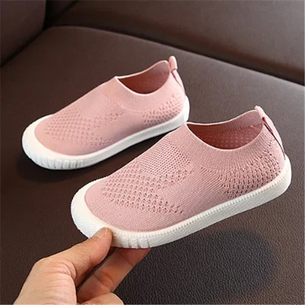 Pink slip-on knit sneakers with white soles, breathable mesh design, casual fit