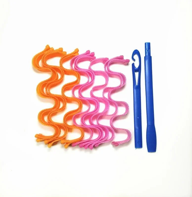 Curly orange and pink hair curlers with two blue plastic styling hooks on white background