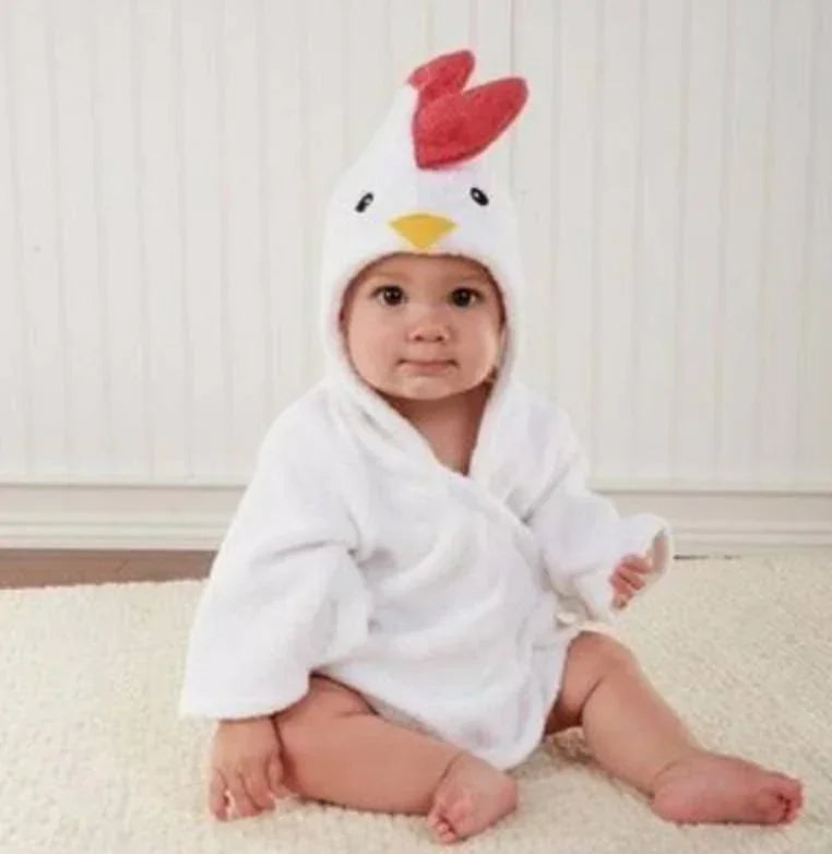 Baby in soft white hooded robe with chicken face and comb, loose relaxed fit, cozy fabric