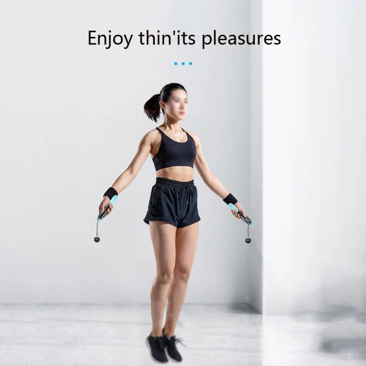 Woman jumping rope in black athletic crop top and loose high-waisted shorts, sporty fit