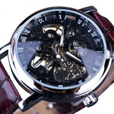 Skeleton dial mechanical wristwatch with Roman numerals, metallic case, and brown leather strap