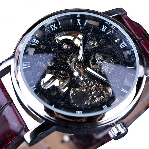 Skeleton dial mechanical wristwatch with Roman numerals, metallic case, and brown leather strap