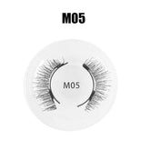 Pair of dramatic black synthetic false eyelashes, style M05, with wispy, voluminous design in plastic case.