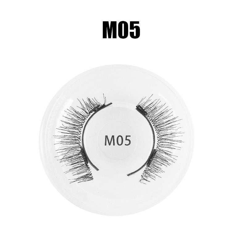 Pair of dramatic black synthetic false eyelashes, style M05, with wispy, voluminous design in plastic case.