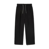 Black wide-leg streetwear pants with elastic waistband and drawstring, relaxed fit