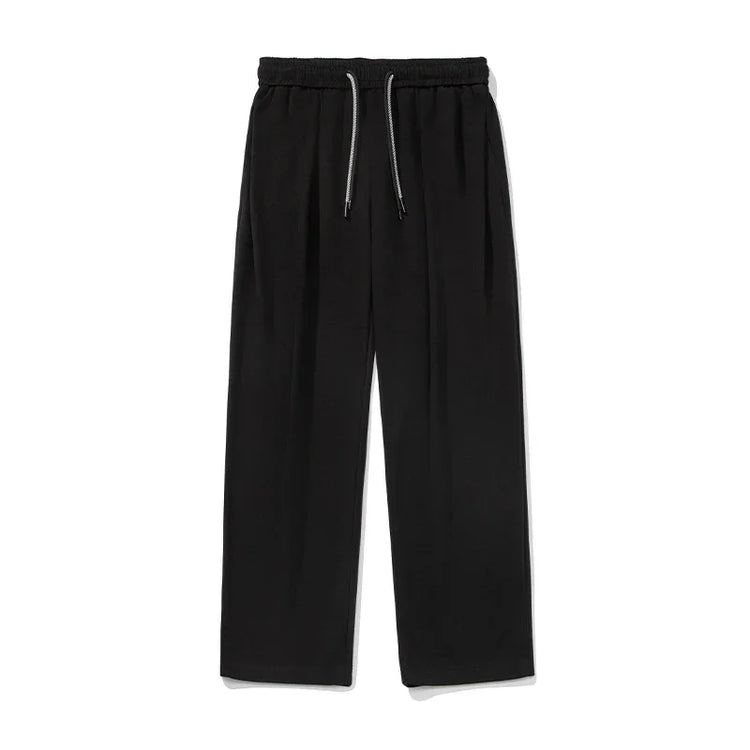 Black wide-leg streetwear pants with elastic waistband and drawstring, relaxed fit