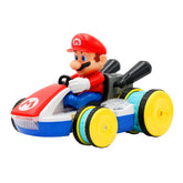 Toy figure in a red hat and blue outfit driving a colorful plastic go-kart on white background.