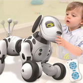 Boy playing with a futuristic interactive robot dog toy, white and black plastic, remote controlled.