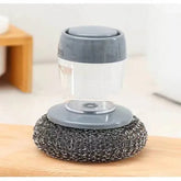 Grey dish scrubber with metal mesh pad and transparent handle, modern kitchen cleaning tool
