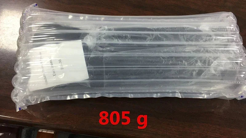 Black clothing item packaged in a clear inflatable protective wrap, weight 805 grams displayed