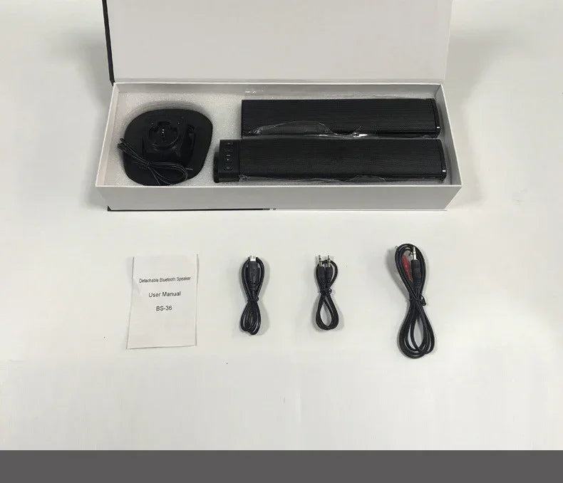 Black detachable Bluetooth speaker set with accessories, user manual, and cables on white background