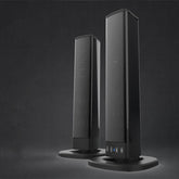 Pair of sleek black tower speakers with mesh finish and touch controls, modern tech accessory