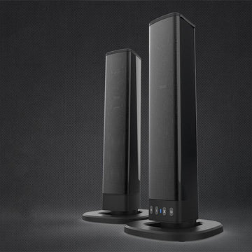 Pair of sleek black tower speakers with mesh finish and touch controls, modern tech accessory