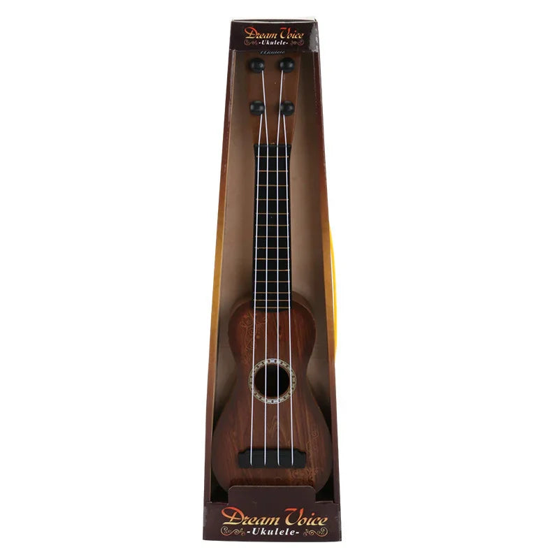 Mini wooden ukulele with black fretboard in decorative box, four strings visible