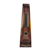 Brown wooden ukulele with black tuning pegs and white strings in display packaging.