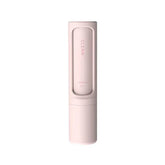Minimalist pink cleaning brush with sleek cylindrical design, compact plastic body