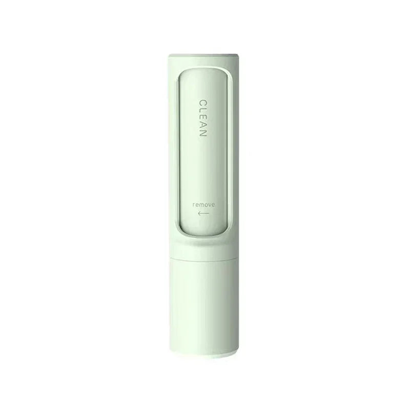 Minimalist white portable cleaning brush with sleek cylindrical design on white background