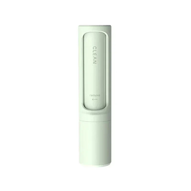 Minimalist white portable cleaning brush with sleek cylindrical design on white background