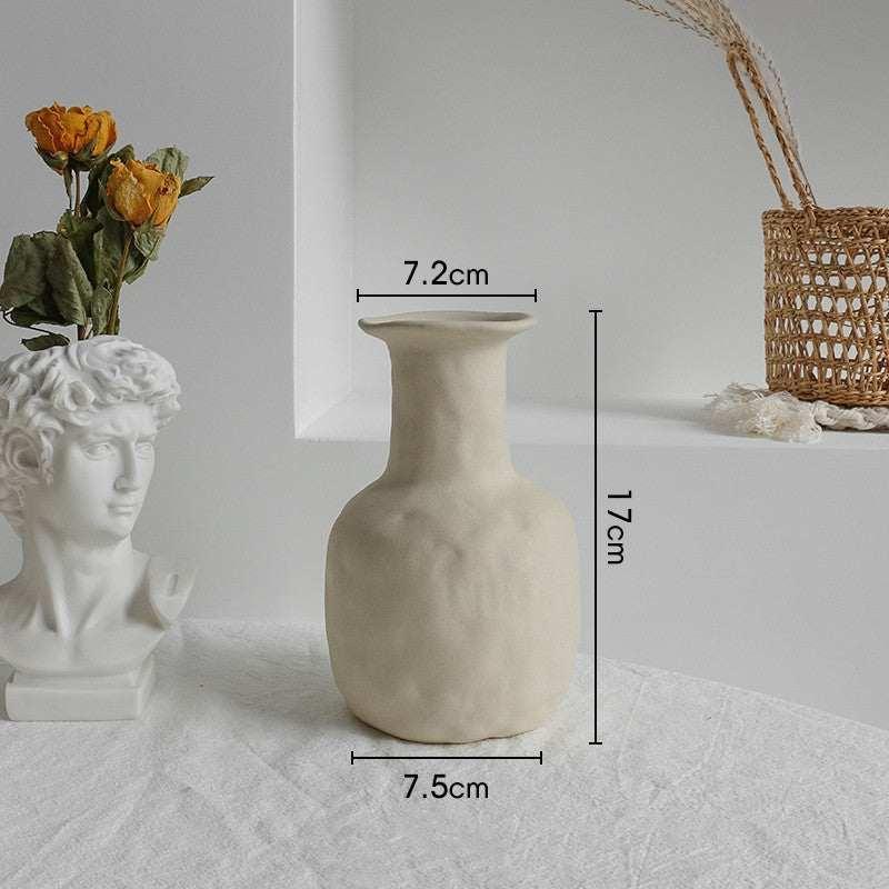 Minimalist off-white ceramic vase with matte finish, relaxed fit, neutral decor style