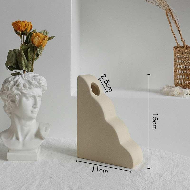 Beige ceramic abstract vase with wavy design, matte finish, minimalist modern decor