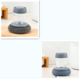 Grey ergonomic dish scrubber with soap dispenser and metal mesh and sponge pads
