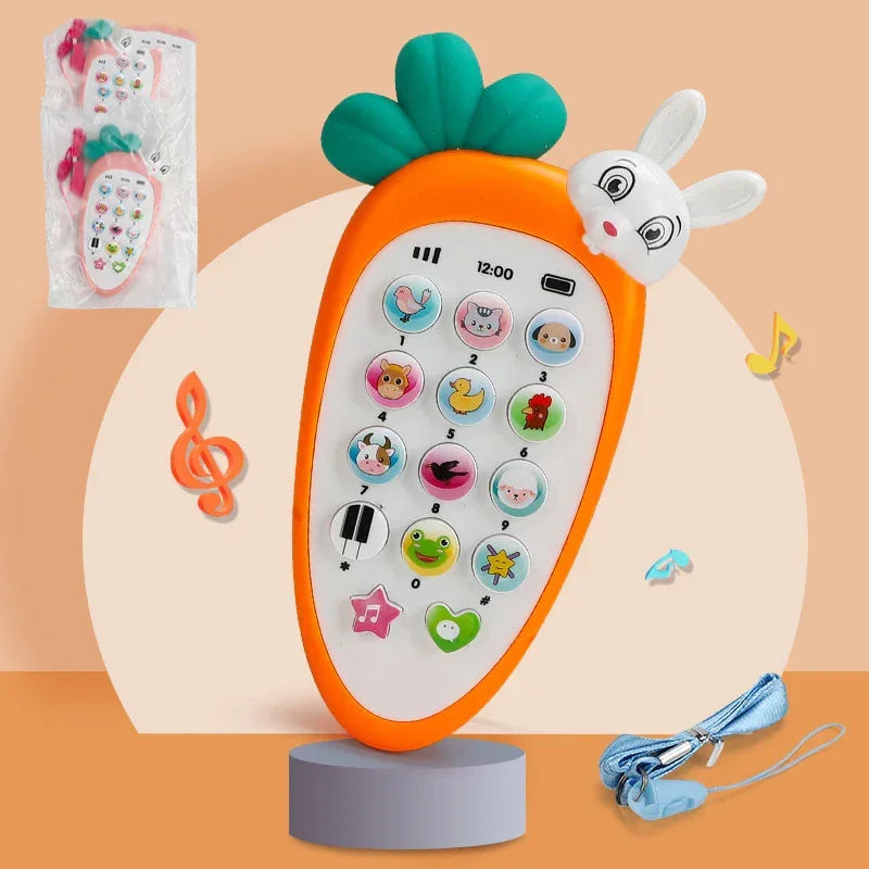 Orange carrot-shaped toy phone with animal buttons, bunny head, and lanyard on neutral background.
