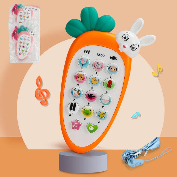 Orange carrot-shaped toy phone with animal buttons, bunny head, and lanyard on neutral background.