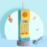 Colorful plastic retro toy phone with keypad, lanyard, and musical note decorations