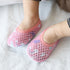 Baby wearing pink mesh slip-on shoes with cute pattern and breathable design