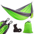Lightweight green and gray nylon hammock with black carabiners, ropes, and matching carry bag