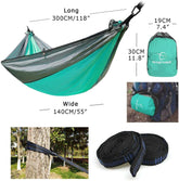 Lightweight teal and gray nylon hammock, compact pack, sturdy straps, outdoor-ready fit.