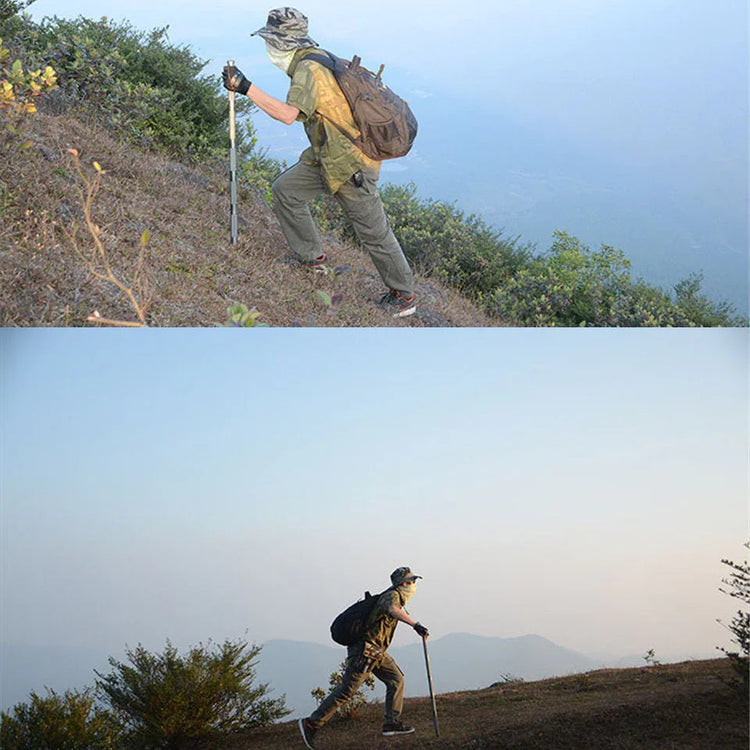 Hiker in loose-fit green cargo pants, lightweight shirt, camouflage hat, and outdoor gear climbing a hill
