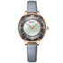 Elegant wristwatch with gold case, mother-of-pearl dial, gray leather strap, minimalist style