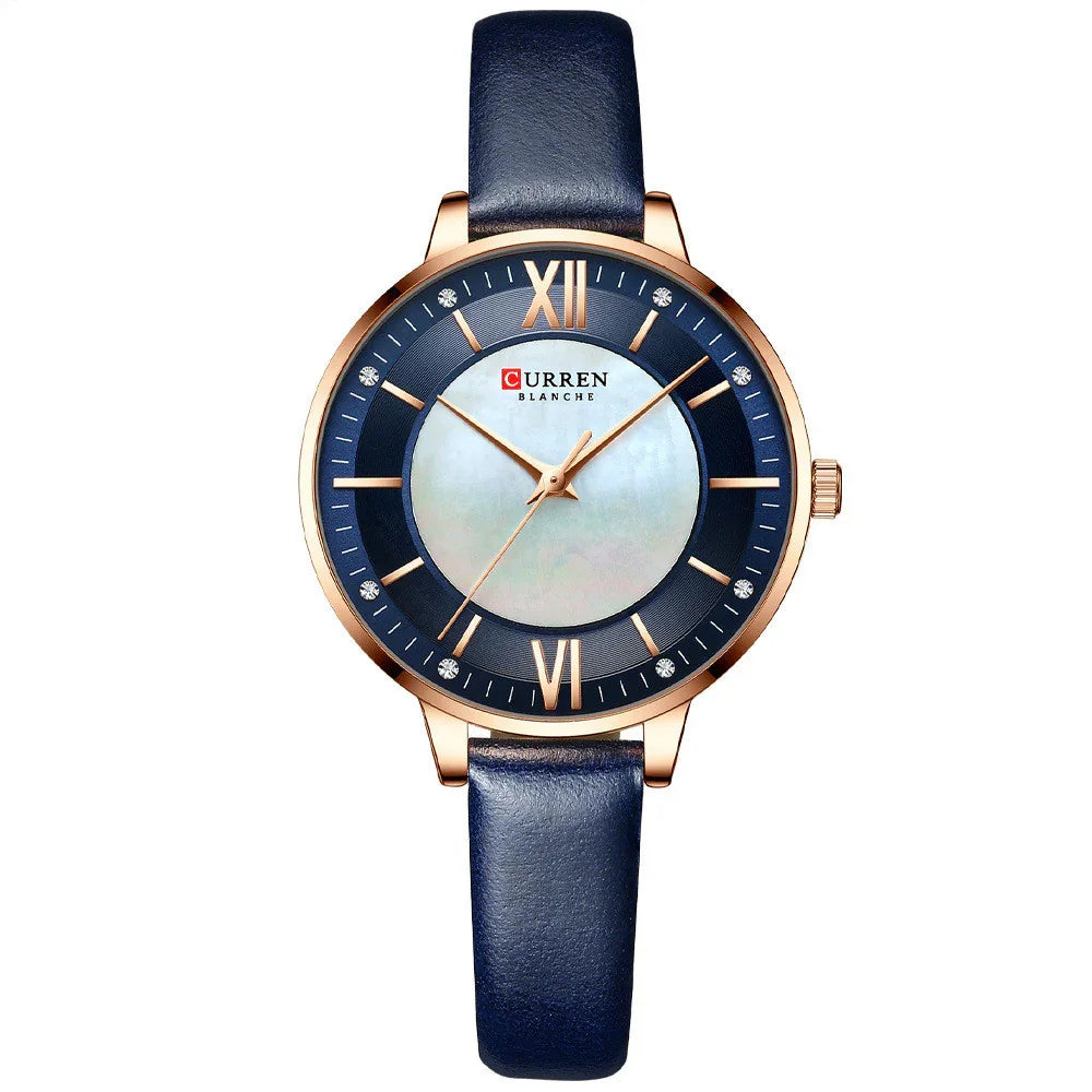 Elegant wristwatch with blue leather strap, gold case, and dark blue dial with roman numerals