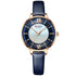 Elegant wristwatch with blue leather strap, gold case, and dark blue dial with roman numerals