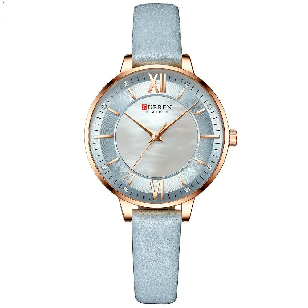 Elegant women's watch with light blue leather strap, rose gold case, and silver dial.