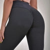 Black textured high-waist leggings with honeycomb pattern, form-fitting athletic wear for streetwear style