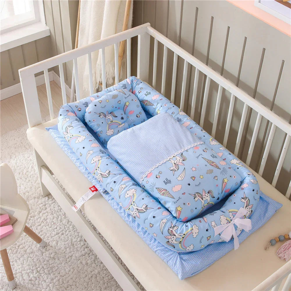 Blue baby bedding set with unicorn print, soft cotton material, placed in white crib
