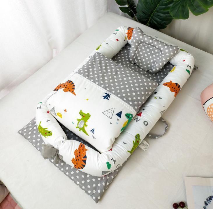 Soft baby nest bed with dinosaur and star print, gray and white color, padded cotton material