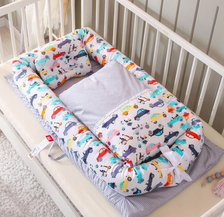 Colorful baby cot bedding set with car print, soft padded material, snug fit in crib