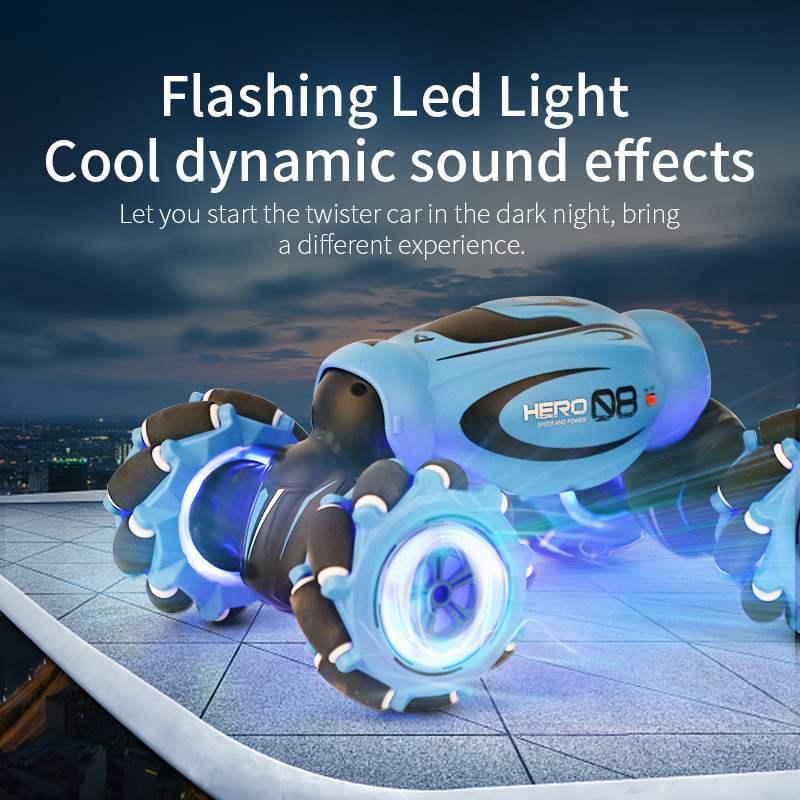 Blue remote control stunt car with LED lights and rugged wheels on rooftop at night