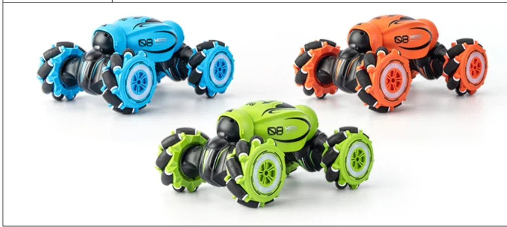 Set of three colorful remote control stunt cars in blue, green, and orange with large wheels
