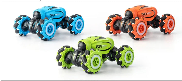 Set of three colorful remote control stunt cars in blue, green, and orange with large wheels