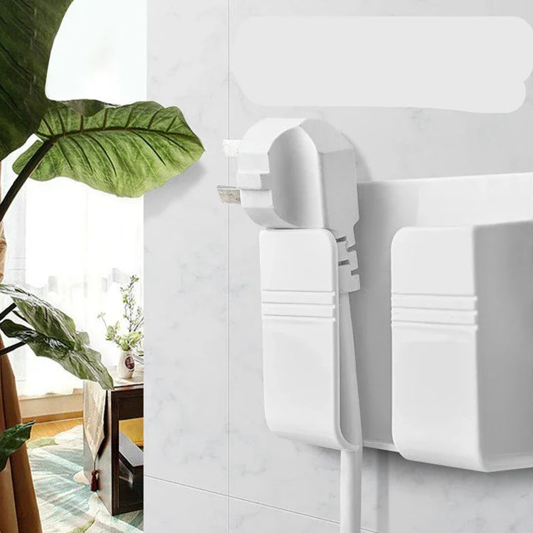 White modern wall-mounted plastic plug and cable holder in minimalist interior