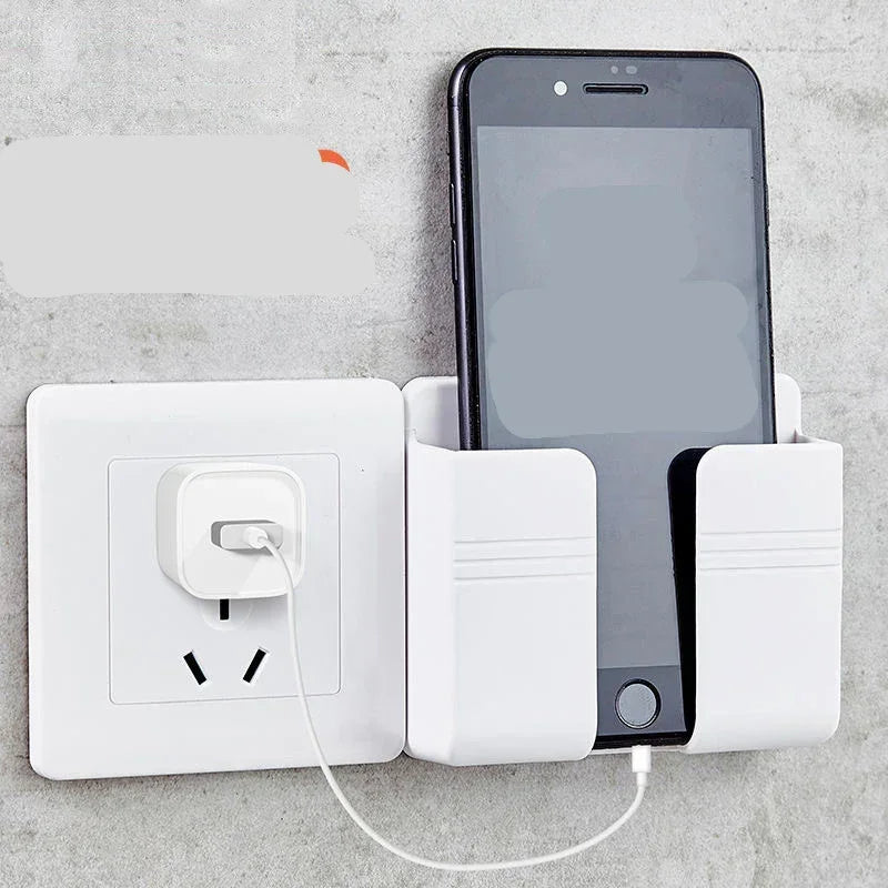 White wall-mounted phone holder with smartphone charging near power outlet