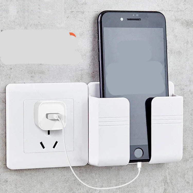 White wall-mounted phone holder with smartphone charging near power outlet
