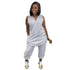 Woman wearing sleeveless gray jumpsuit with relaxed fit and cropped jogger-style legs