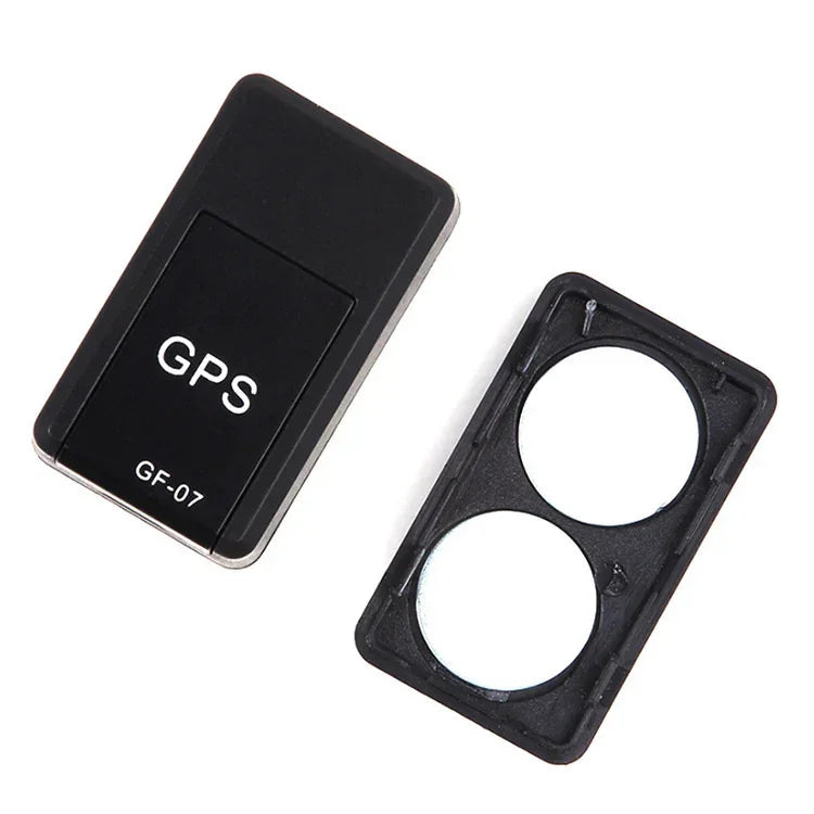 Black GPS tracking device with opened battery compartment cover, compact rectangular design