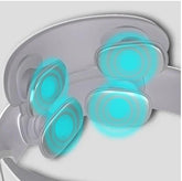 Close-up of a white adjustable wearable device with glowing blue massage pads and smooth finish.