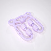 Light purple plastic massage roller with textured rollers and ergonomic handles on white background